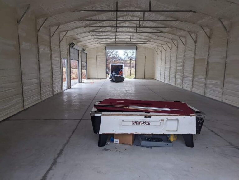 A barn after spray foam has been applied to both the interior of the roof and the walls