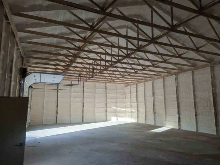 A barn after spray foam has been applied to both the interior of the roof and the walls