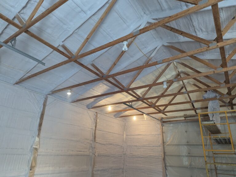 Spray foam being installed in the interior roof of a property